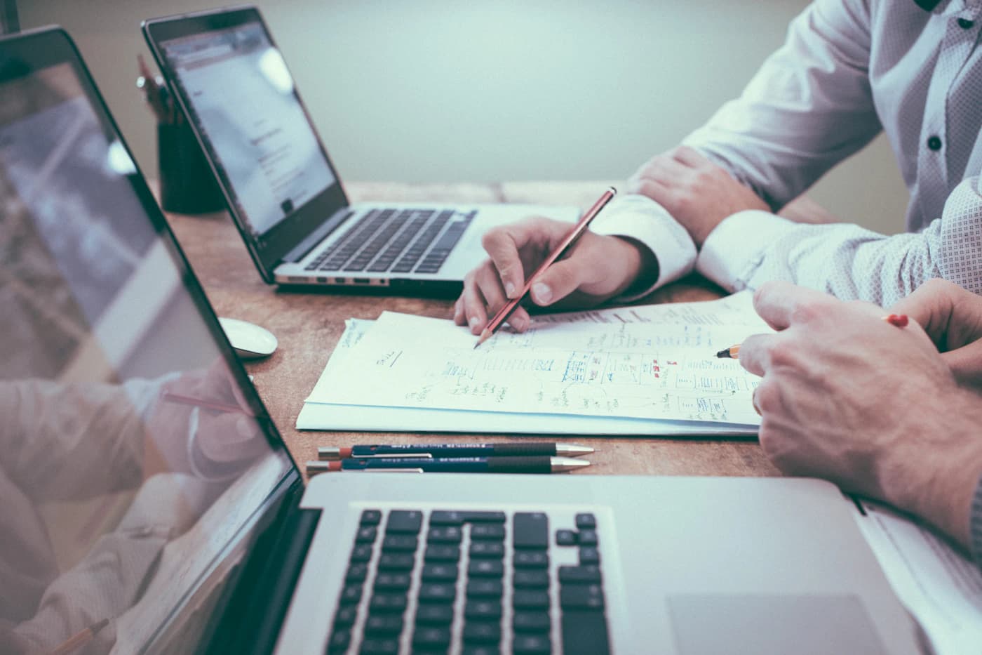 Accountant reviewing client tax documents at desk