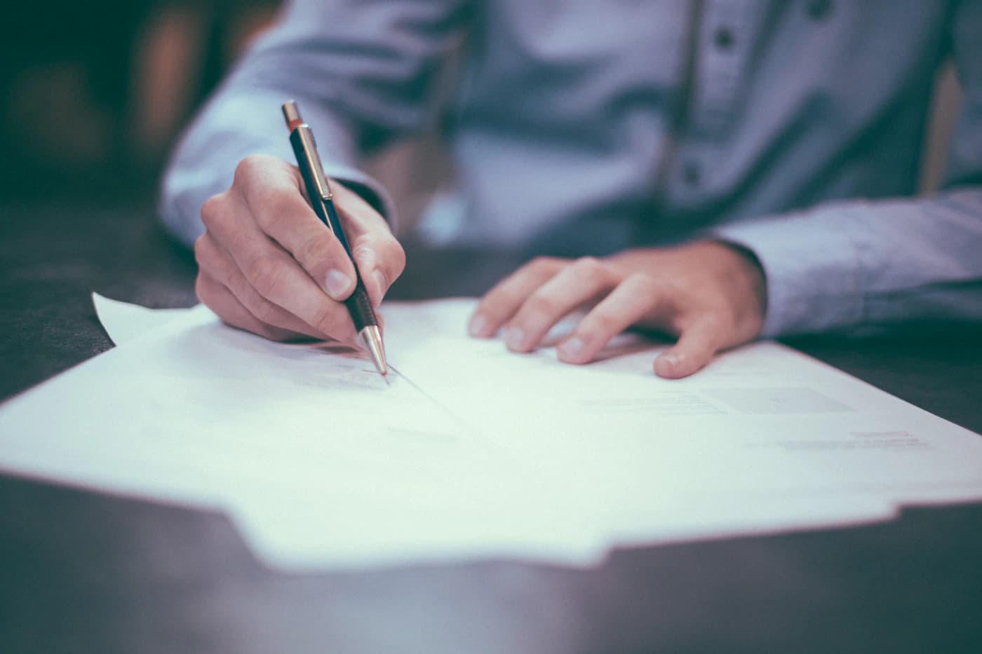 Lawyer reviewing case documents at desk